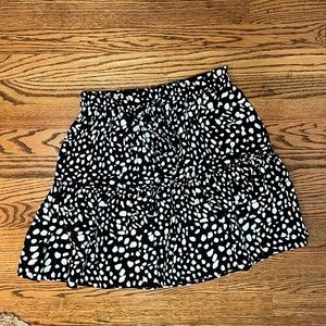 Black and tan printed skirt. New, never worn. Size Medium